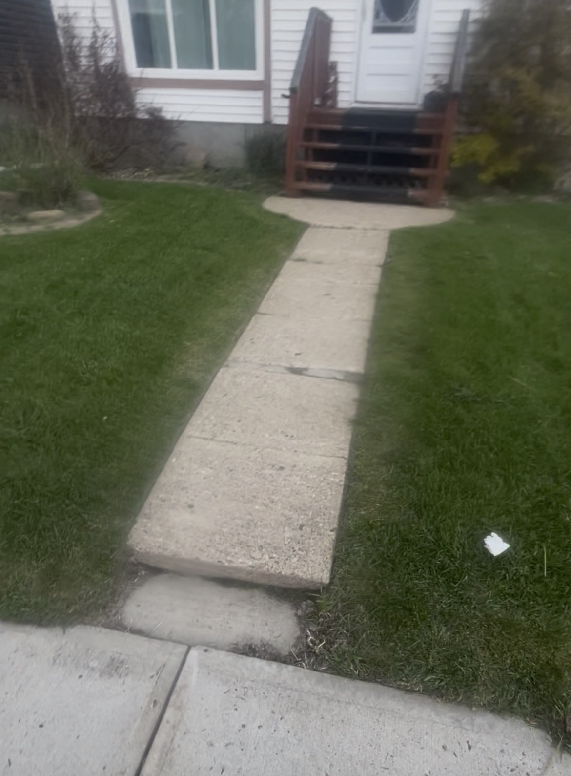 String trimmer working a lawn edge